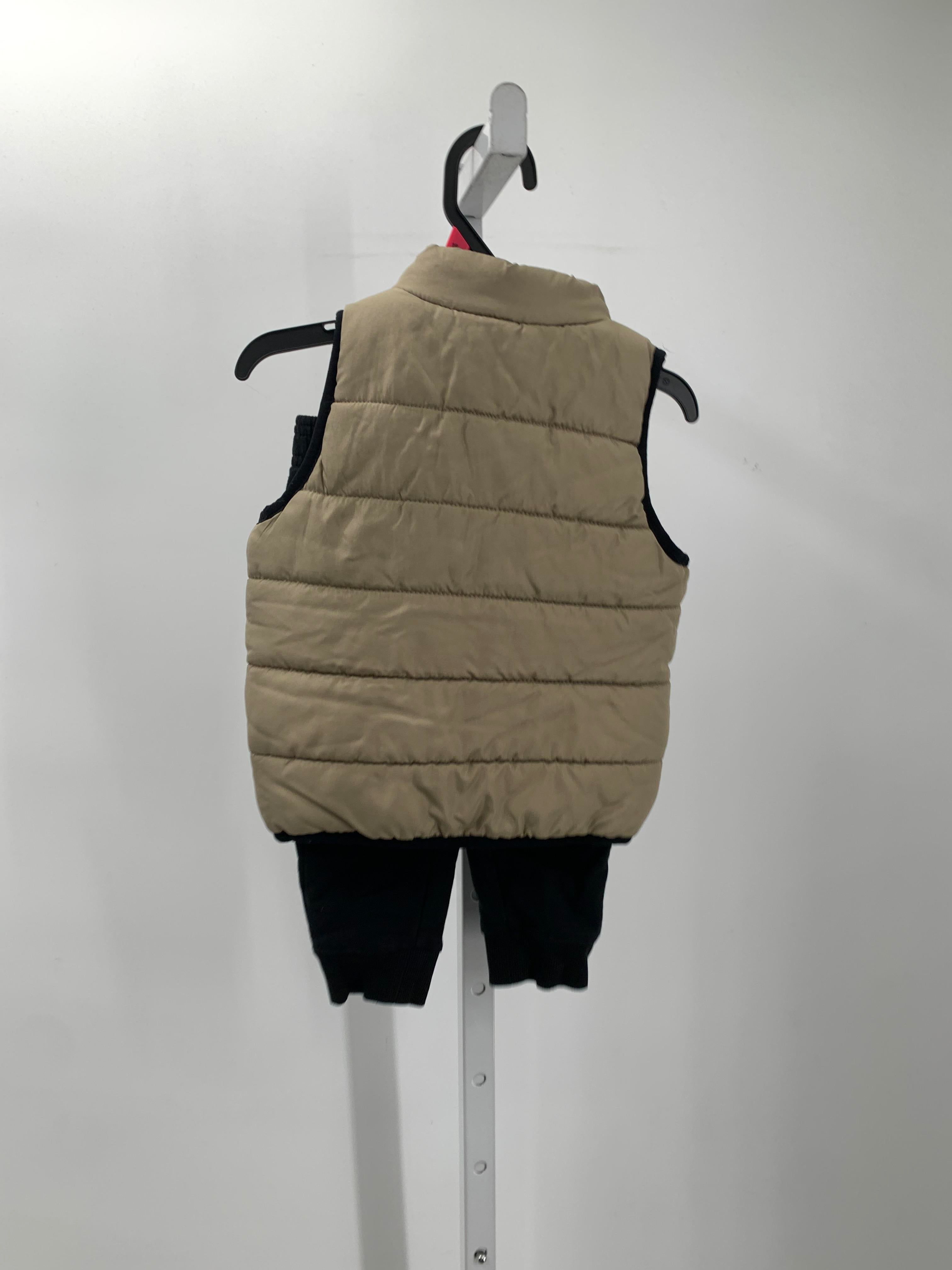 PUFF VEST AND BLACK PANTS