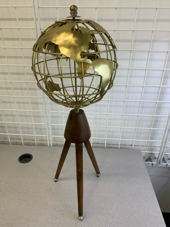 STANDING GOLD GLOBE ON WOODEN LEGS.