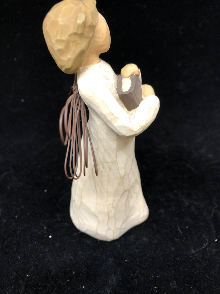 GIRL HOLDING BOOK ANGEL OF READING.