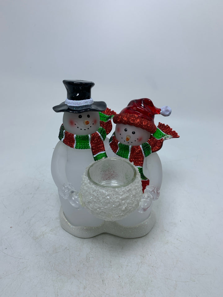 2 ACRYLIC SNOWMAN/WOMAN HOLDING TEA LIGHT HOLDER.