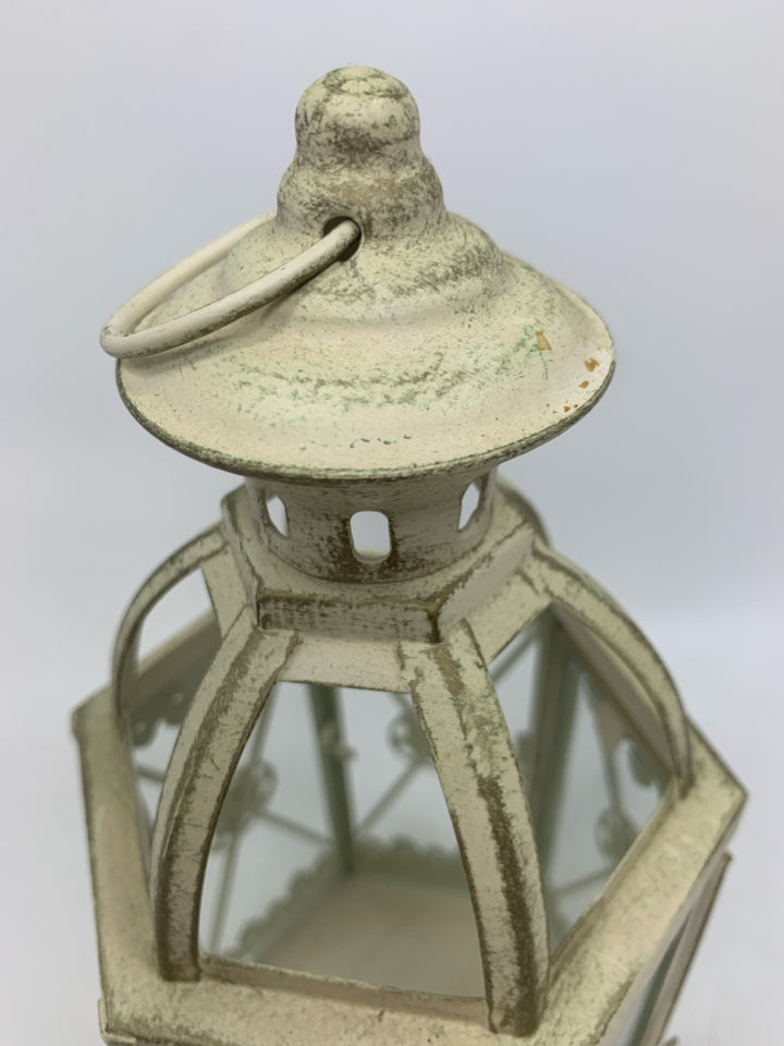DISTRESSED CANDLE LANTERN.