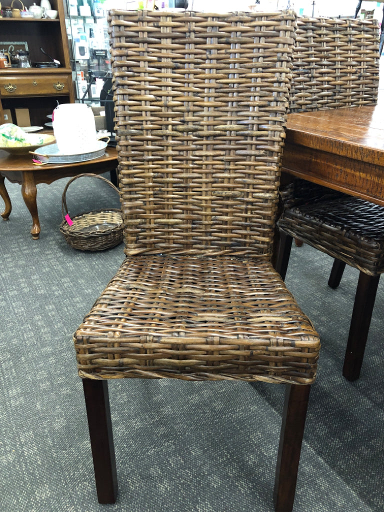 DARK WOOD STRESSED WOOD PATTERN TABLE W 6 WICKER WOVEN CHAIRS.