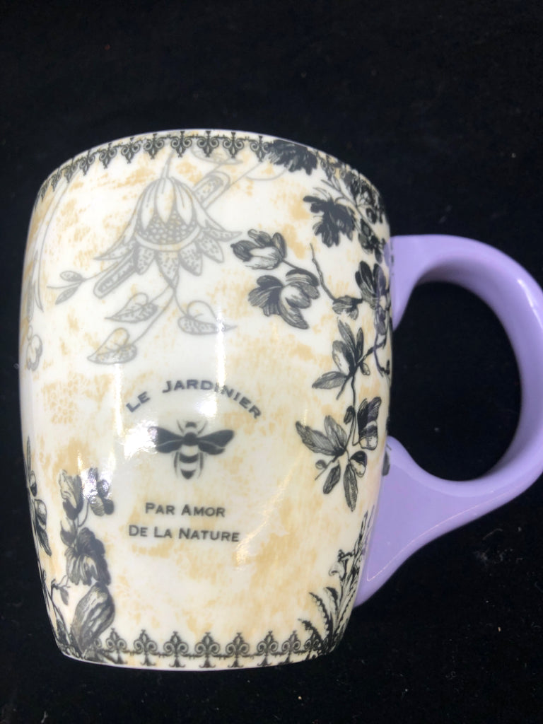 FLORAL MUG W PURPLE HANDLE.
