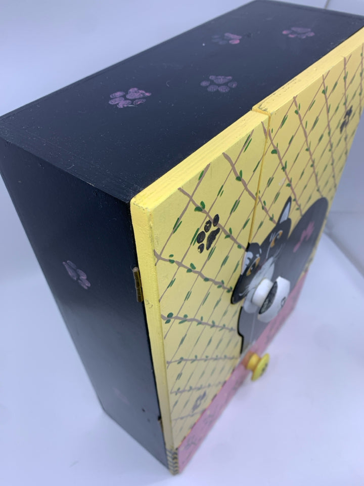 BLACK/WHITE PAINTED CAT W/ YELLOW BACKGROUND W/DRAWER WALL HANGING.