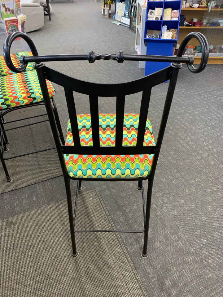 3 METAL SCROLL BAR STOOLS W/COLORFUL UPHOLSTERED SEAT.
