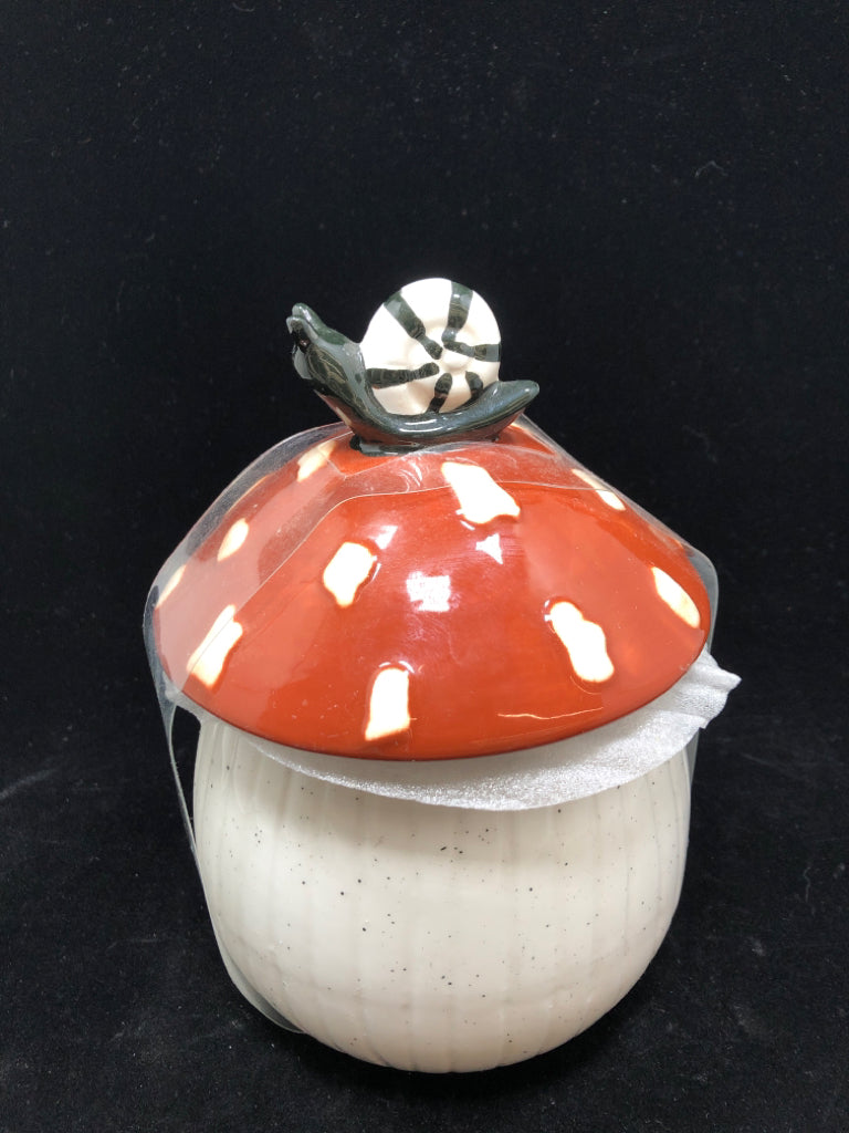 NIP SNAIL ON MUSHROOM SPECKLED CANISTER.