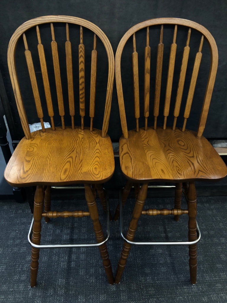 2 WOODEN SWIVEL CHAIRS.