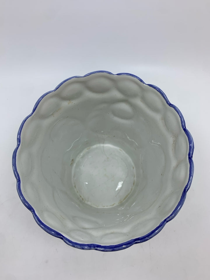HAND PAINTED CERAMIC PLANTER W/BLUE FLORAL ACCENTS.