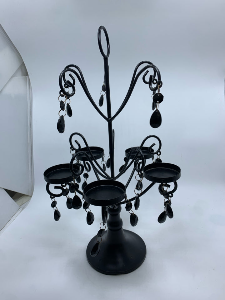 BLACK CANDLE HOLDER W/DANGLING GEMS.