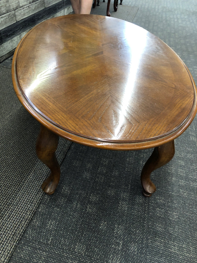 DARK WOOD OVAL COFFEE TABLE.