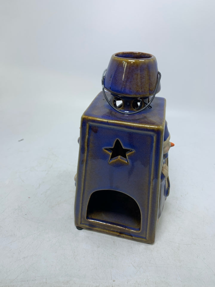 BLUE GLAZED PIERCED LANTERN W/ EMBOSSED SNOWMEN TEALIGHT HOLDER.