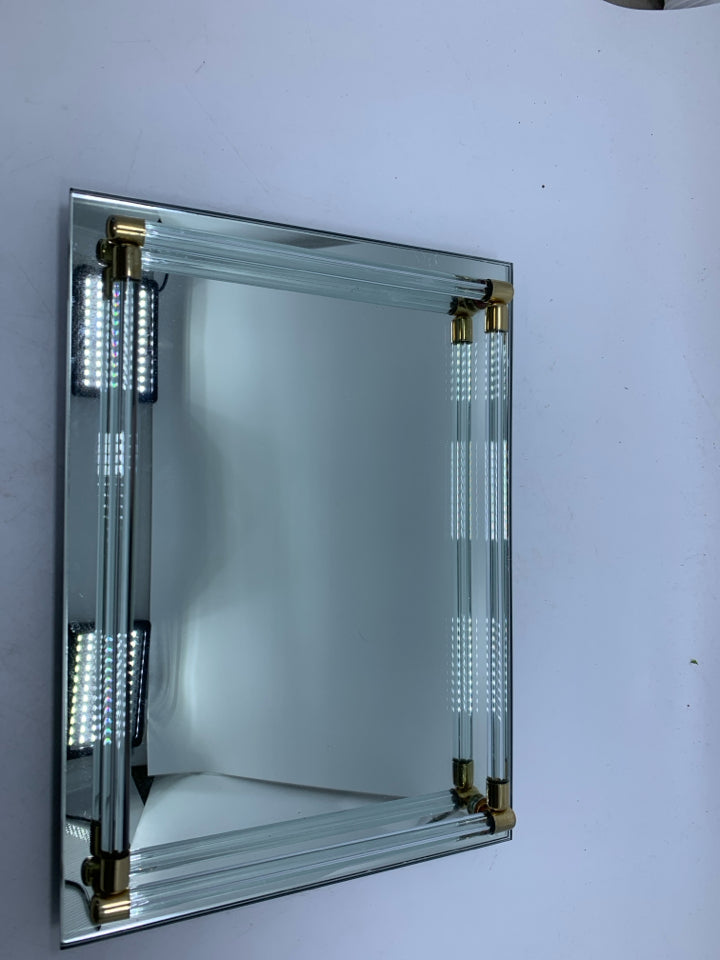 FOOTED MIRROR TRAY W/ LIP AROUND EDGE GOLD DETAILS.