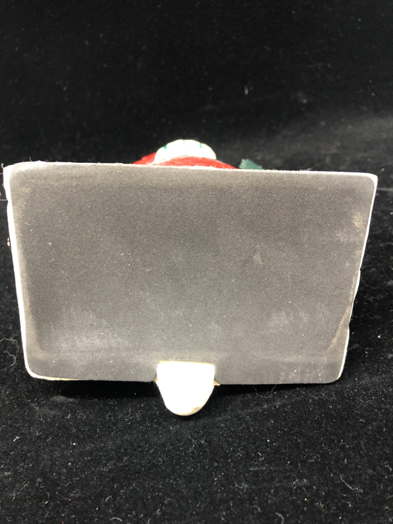 NIB WOOD CARVED SANTA W/PUPPIES STOCKING HOLDER.