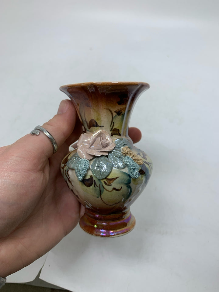 SMALL BROWN VASE W/ EMBOSSED FLOWERS.