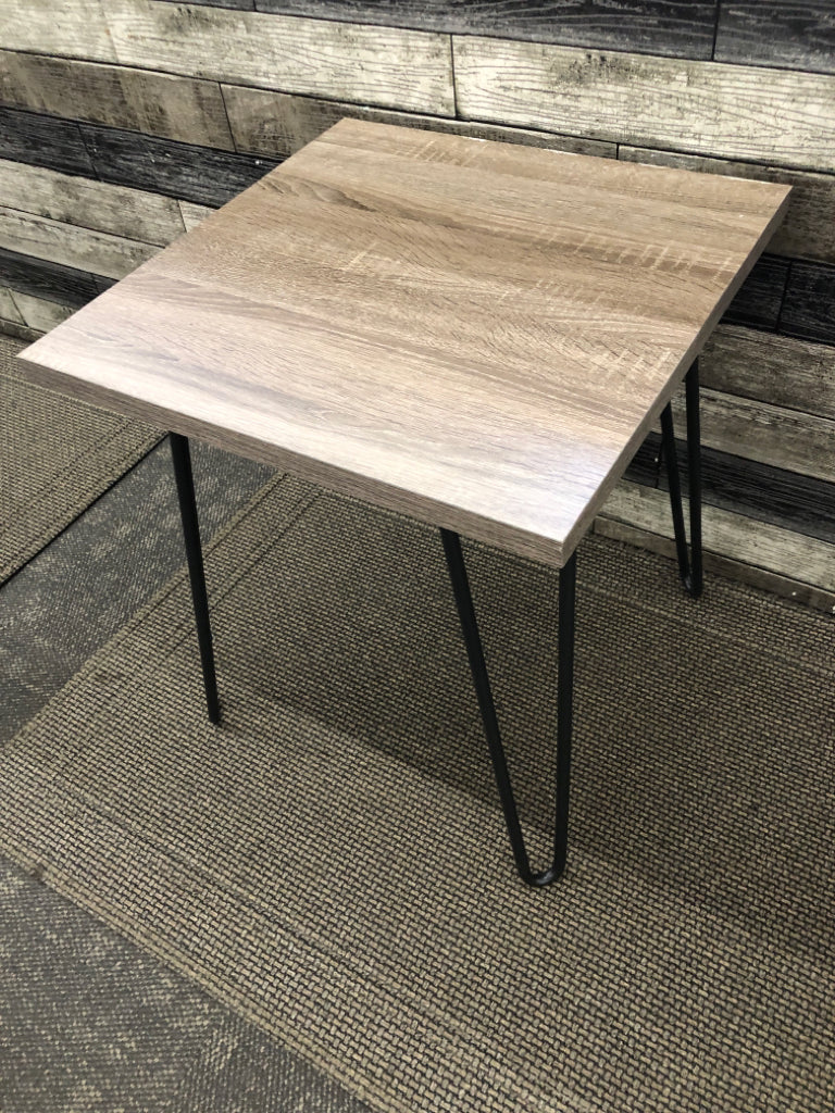 FAUX GREY WOOD SIDE TABLE W/ BLACK METAL PIN HAIR LEGS.