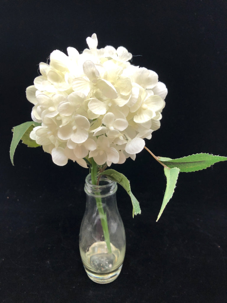 FAUX WHITE HYDRANGEA IN CLEAR GLASS BOTTLE.