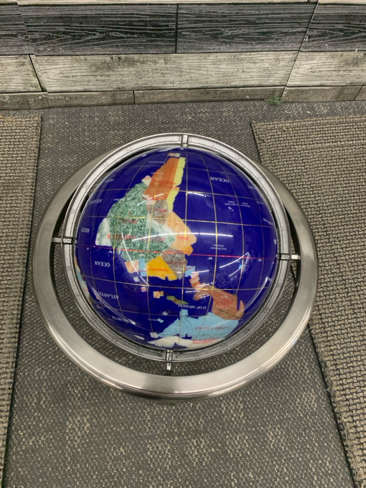 GLOBE WITH DIFFERENT STONE COUNTRIES.