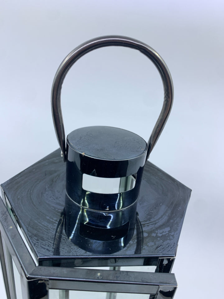 METALLIC LANTERN W GLASS DOORS.