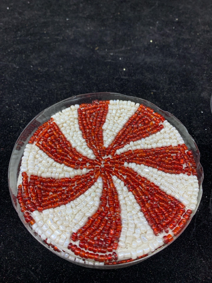 4 NIP RED SWIRL BEADED COASTERS.