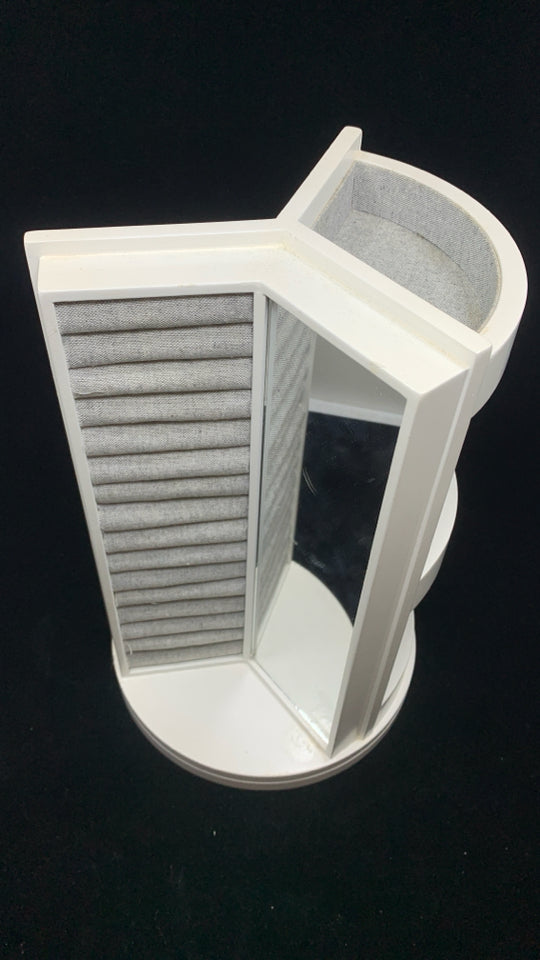 ROTATING GRAY FABRIC JEWELRY HOLDER.