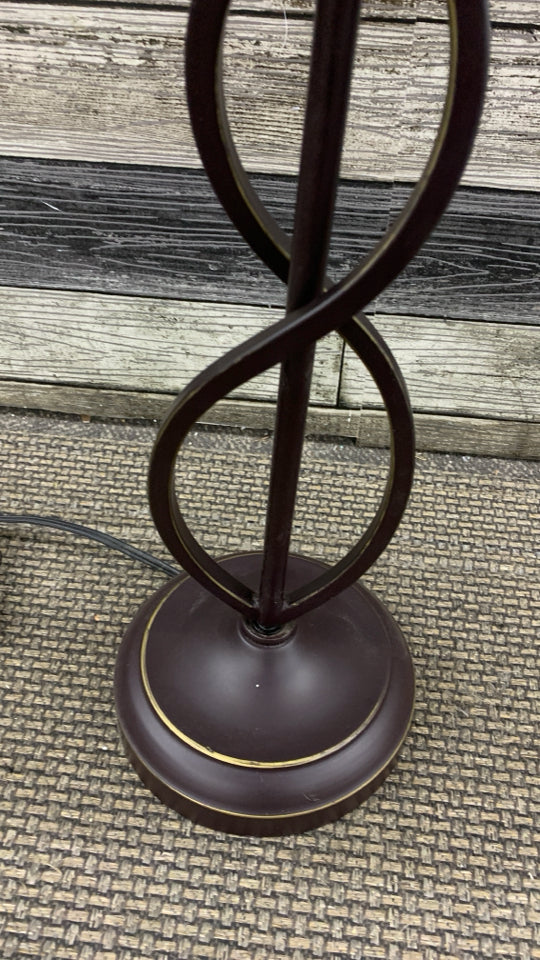 BROWN SCROLL BASE LAMP W/TAN SHADE.