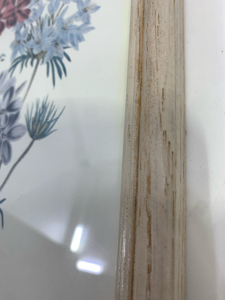 FLORAL PRINT IN DISTRESSED WHITE WOOD FRAME.