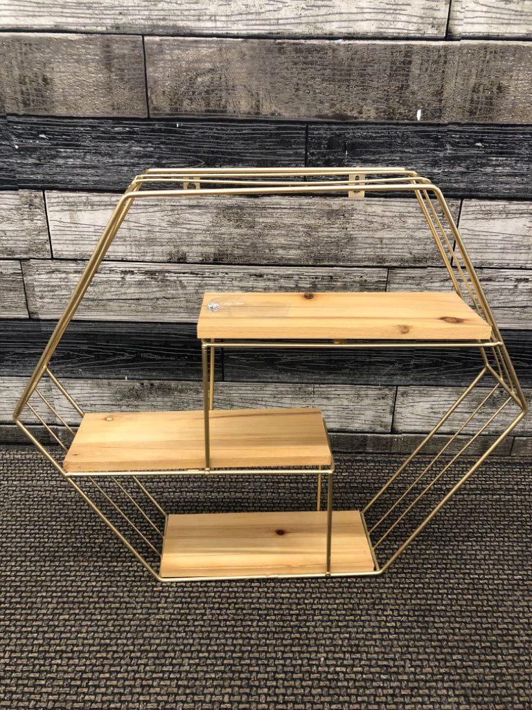 GOLD HEXAGONAL WALL SHELF.