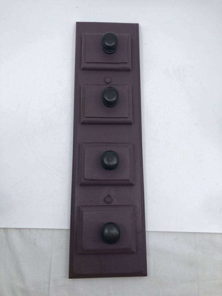 PURPLE WOOD SLATE W/ 4 BLACK KNOBS WALL HANGING.