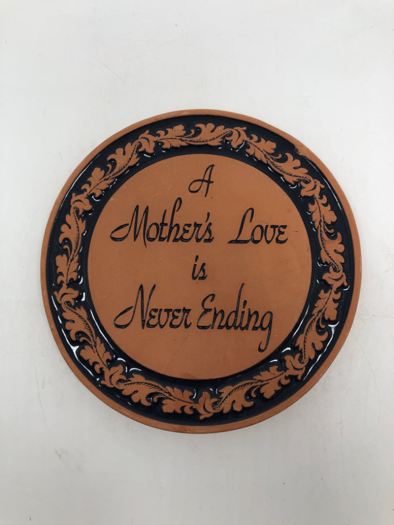 A MOTHER LOVE TERRA COTTA TRIVET.