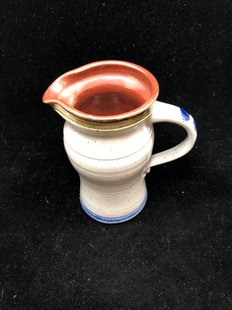 PRIMITIVE STONEWARE PITCHER WITH HEART.