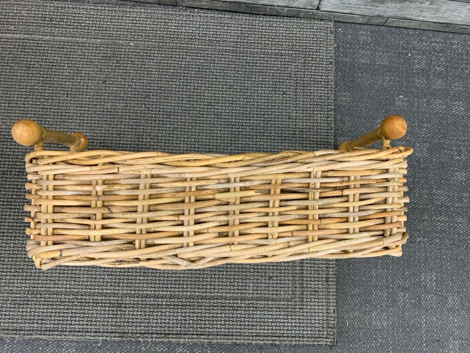 WOVEN WICKER BASKET W/WOODEN BULB HANDLES.