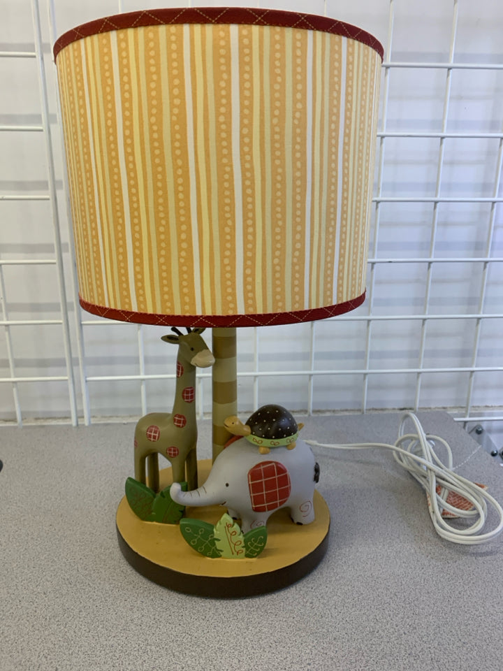 SAFARI ANIMALS LAMP W/ORANGE STRIPED SHADE.