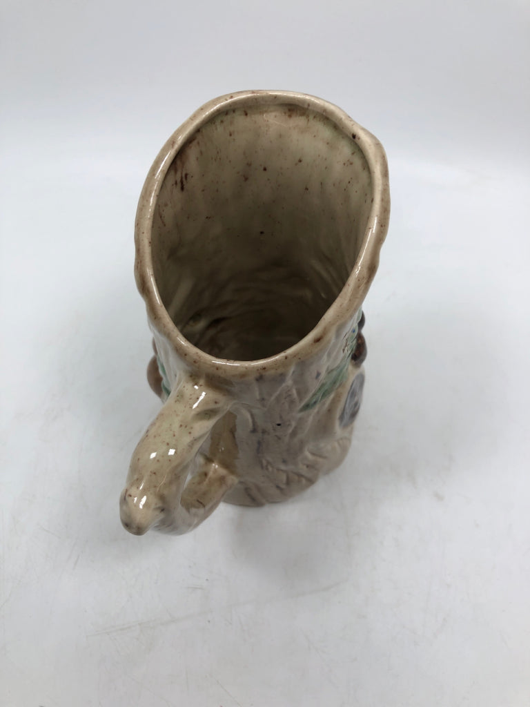 TREE TRUNK PITCHER W/ EMBOSSED MUSHROOMS.