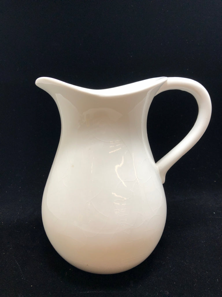 WHITE CERAMIC PITCHER.