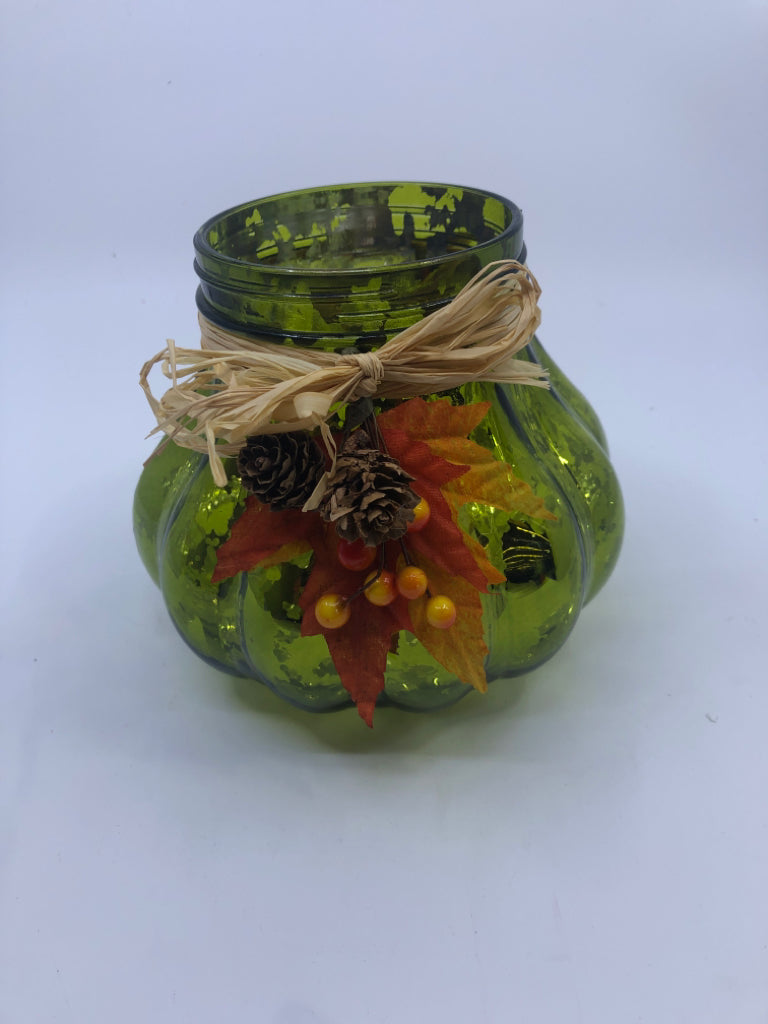 GREEN GLASS CANDLE HOLDER W/LEAVES AND BERRIES.