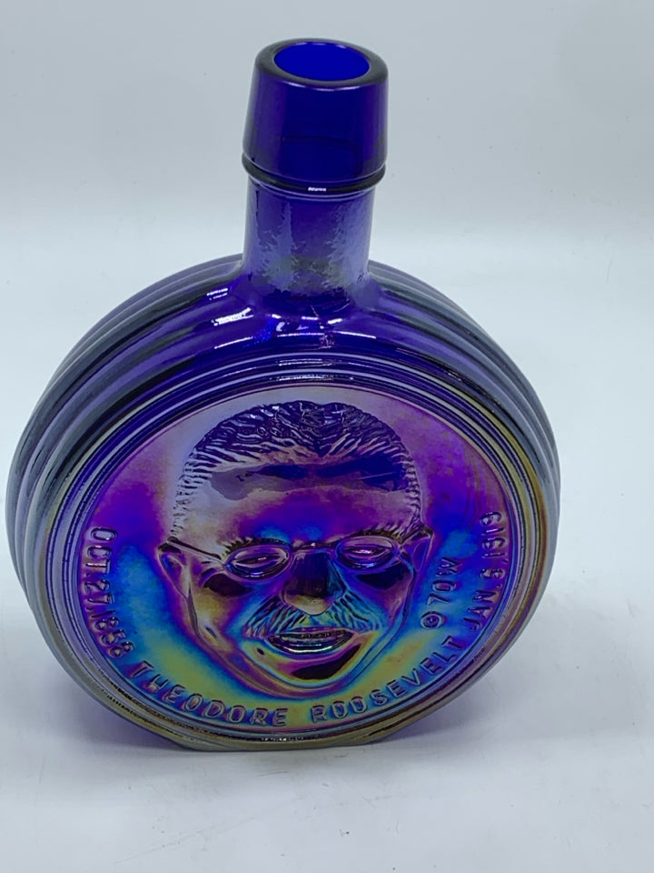 VTG PURPLE IRIDESCENT GLASS ROOSEVELT EMPTY BOTTLE.