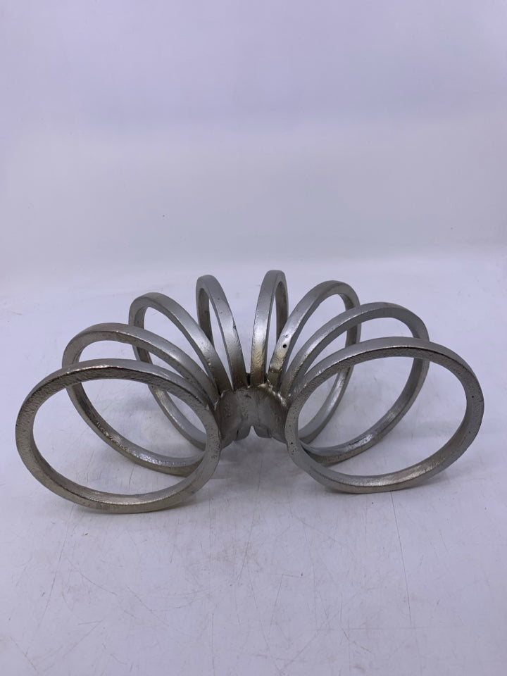 METAL SLINKY DESK DECOR.