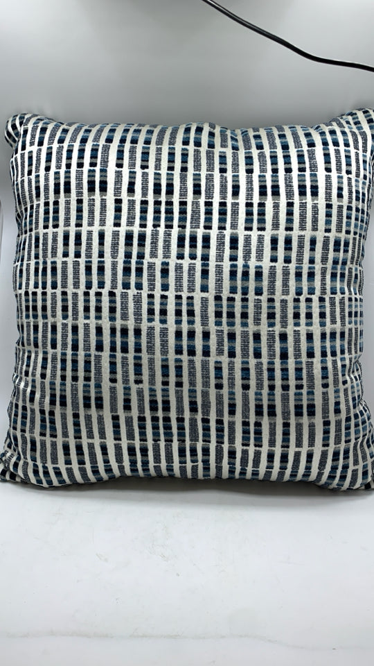 MULTI-STITCHED BLUE ACCENT PILLOWS.