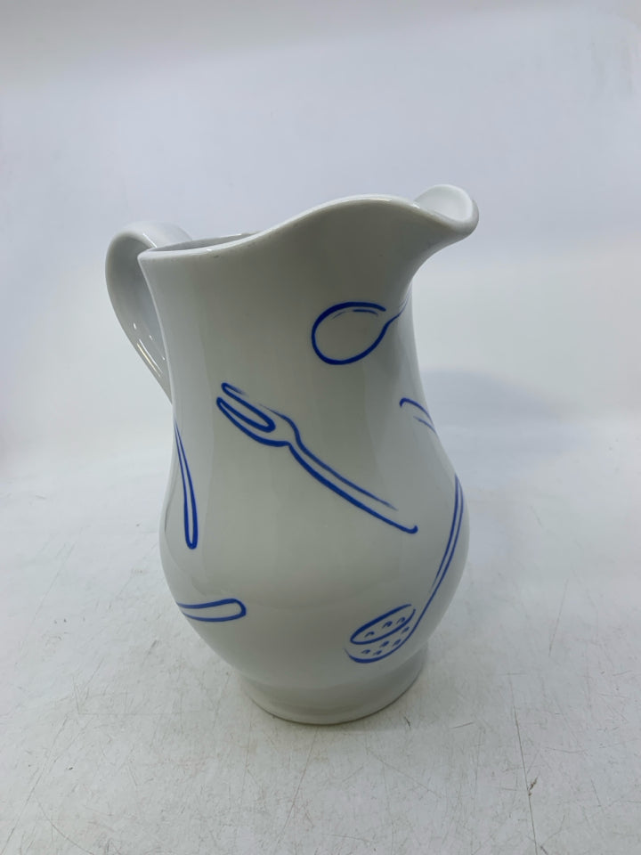 CERAMIC W/ ASSORTED BLUE UTENSILS.