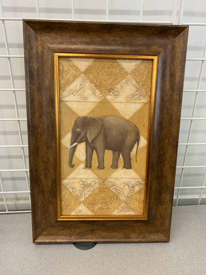 ELEPHANT PRINT IN BROWN/GOLD FRAME.