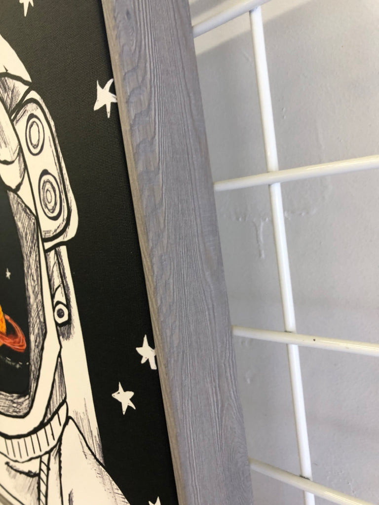 ASTRONAUT CANVAS IN GREY WOOD FRAME.