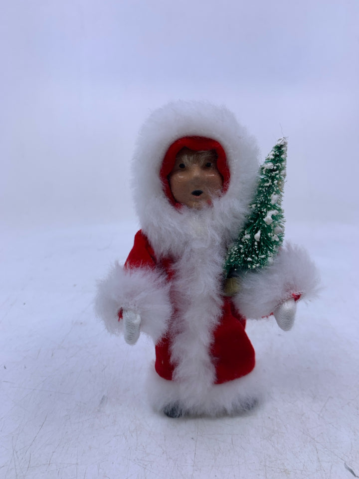 KID HOLDING CHRISTMAS TREE BYERS' CHOICE 1992.
