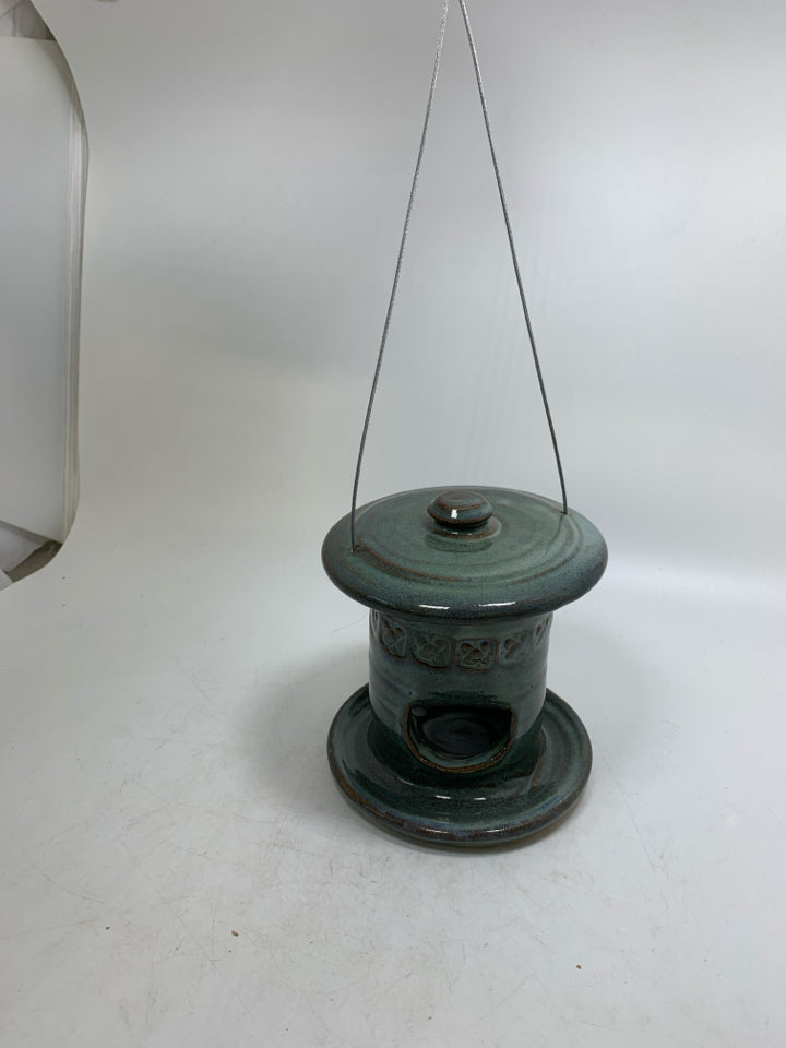 TEAL POTTERY HANGING BIRD FEEDER.