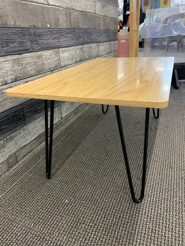 SMALL WOOD TABLE W/BLACK LEGS.