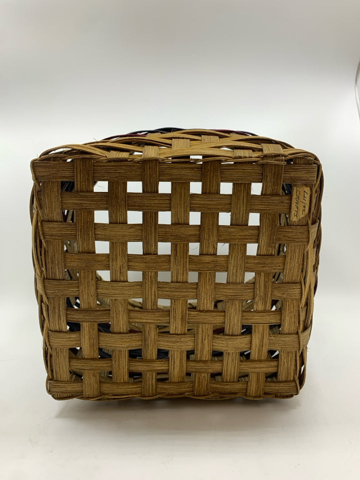 HANDMADE ROUND WOVEN SQUARE BOTTOM BASKET W/PURPLE AND BLUE LINES.