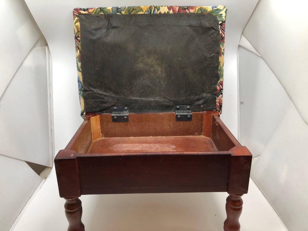 VTG BLUE FLORAL UPHOLSTERED STOOL W/WOOD BASE AND STORAGE.