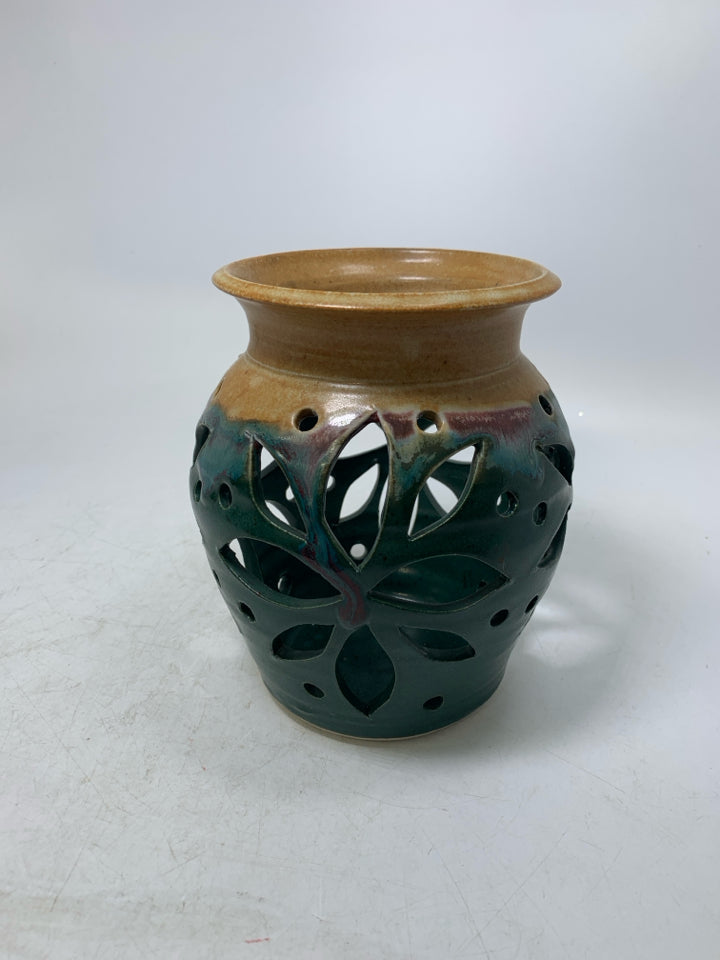DARK GREEN PIERCED POTTERY CANDEL HOLDER/VASE W/ TAN TOP.