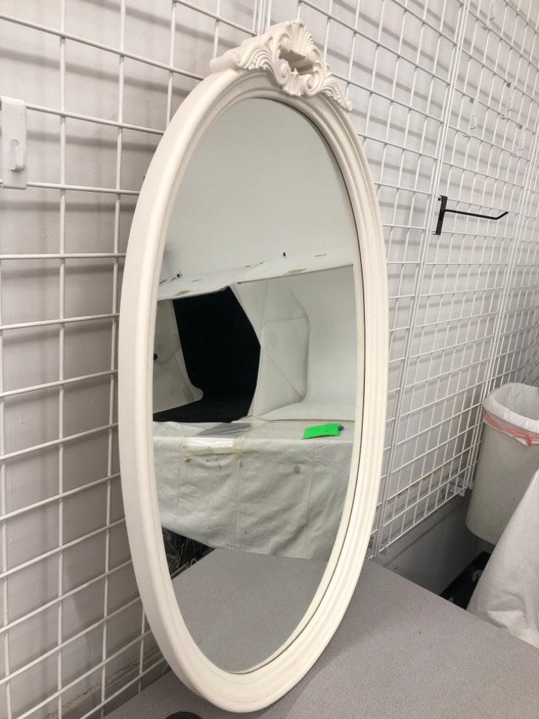OVAL WHITE MIRROR W/ DECORATIVE TOP.