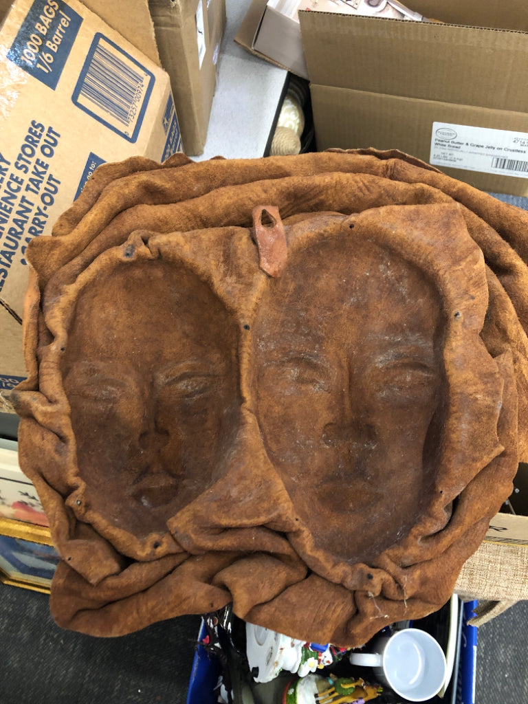 2 EMBOSSED WOMAN FACES MADE OF LEATHER WALL ART.