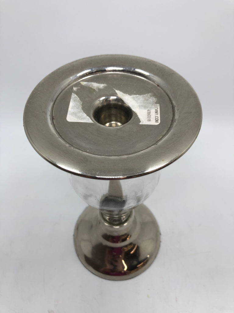 GLASS AND SILVER PILLAR CANDLE HOLDER.